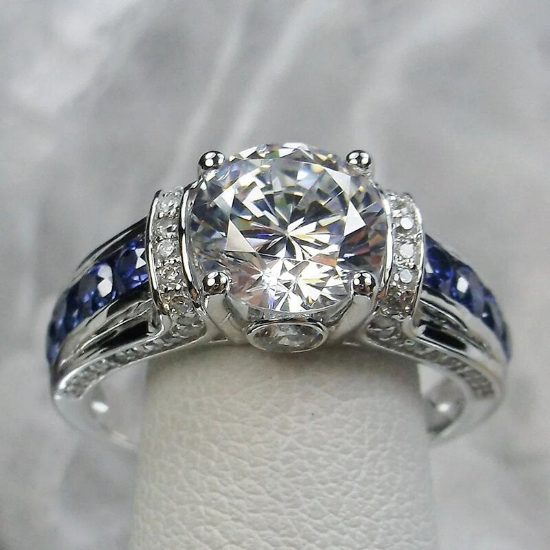 S925 Silver Round‑Cut Diamond Ring With Blue Gem Inlaid Band