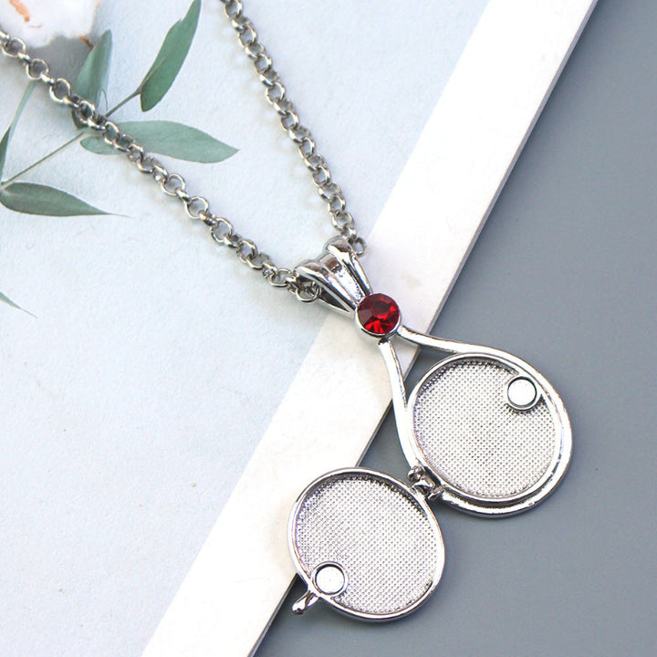 Magnetic flip-top shell necklace with diamond-encrusted mermaid design
