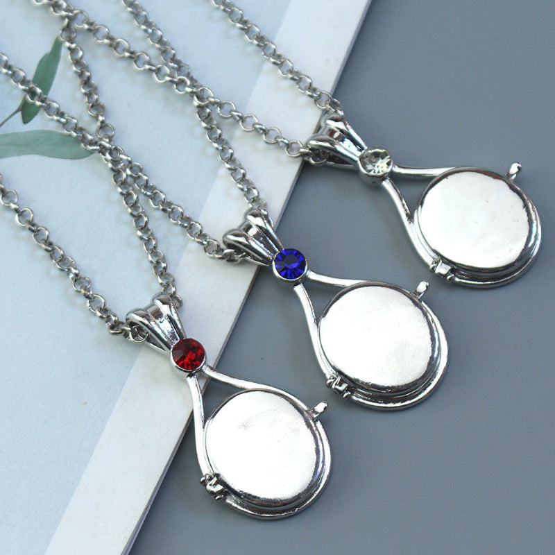 Magnetic flip-top shell necklace with diamond-encrusted mermaid design