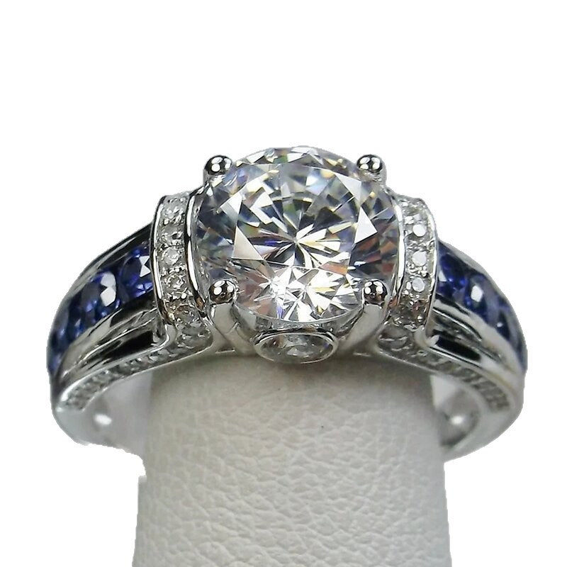 S925 Silver Round‑Cut Diamond Ring With Blue Gem Inlaid Band