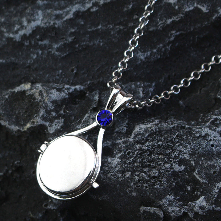 Magnetic flip-top shell necklace with diamond-encrusted mermaid design