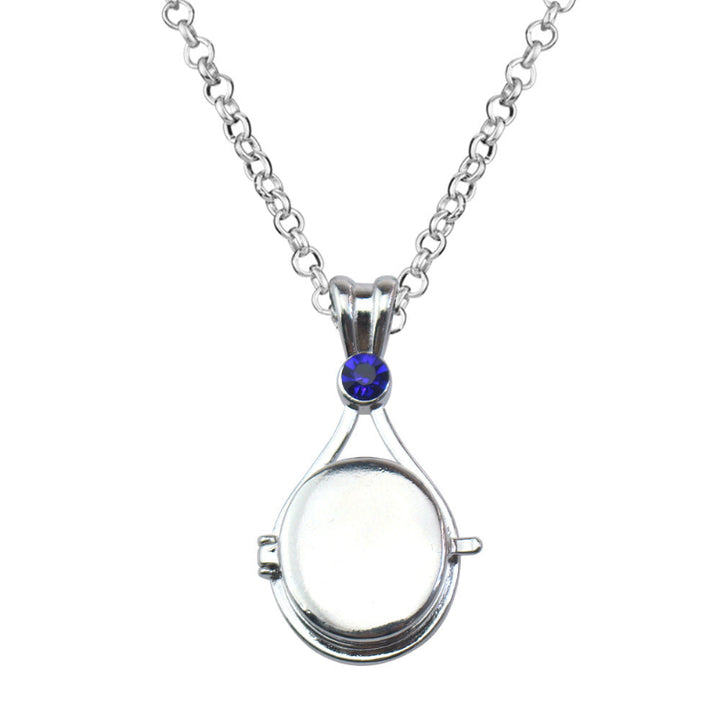 Magnetic flip-top shell necklace with diamond-encrusted mermaid design