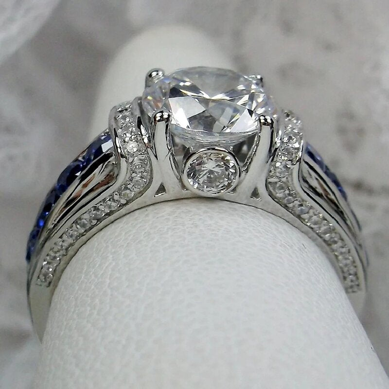 S925 Silver Round‑Cut Diamond Ring With Blue Gem Inlaid Band