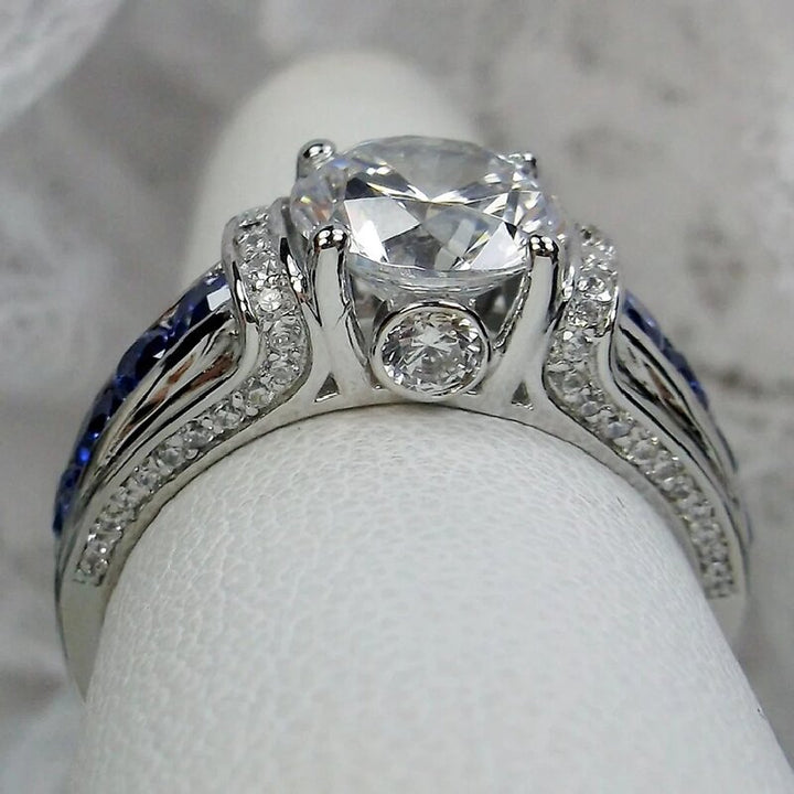 S925 Silver Round‑Cut Diamond Ring With Blue Gem Inlaid Band